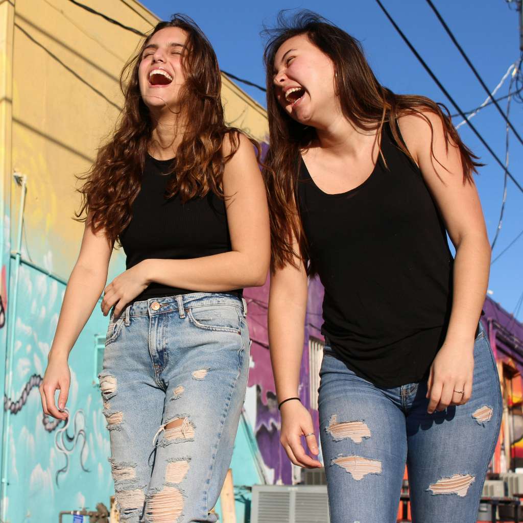 two girls laughing